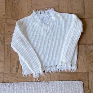 K am selling a sweater from poof apparel